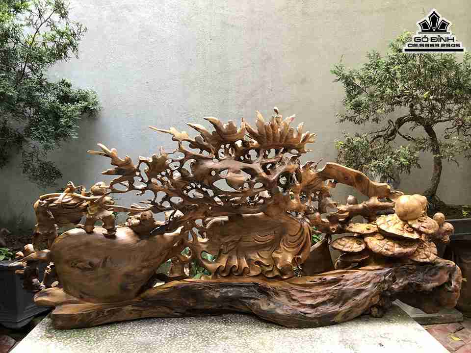 Tuong-Phat-Di-Lac-Keo-Bao-Tien-Go-Bach-Xanh