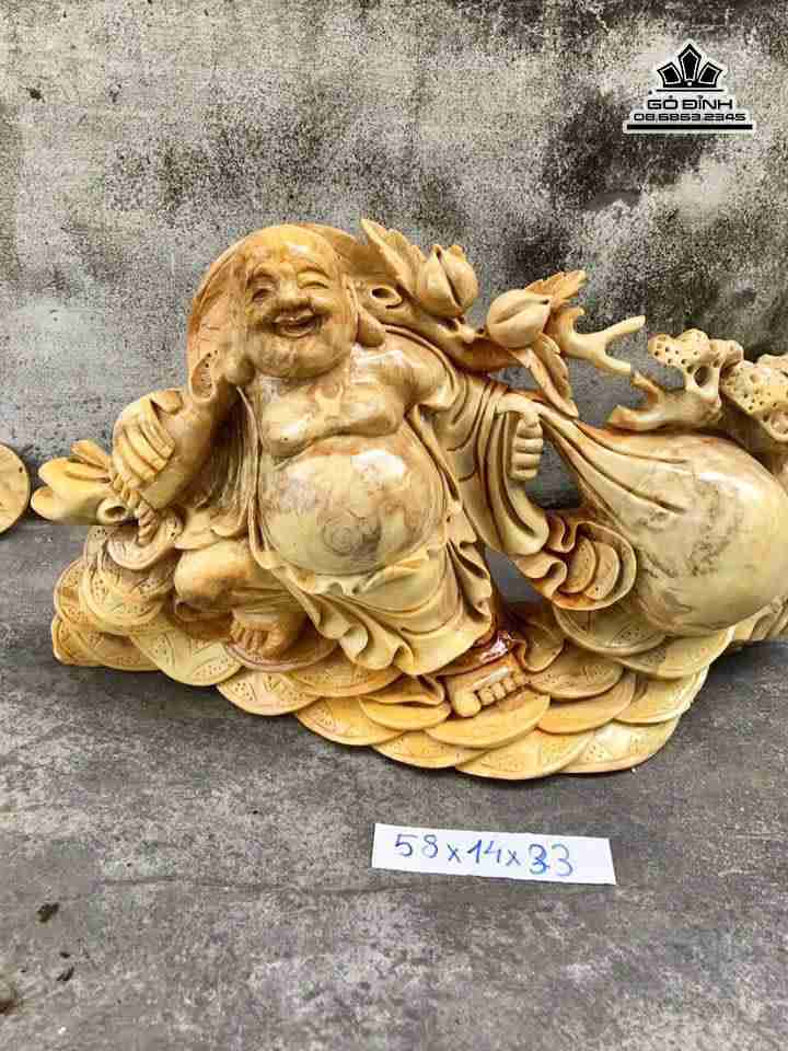 Phật di lặc kéo bao tiền gỗ nu nghiến  1