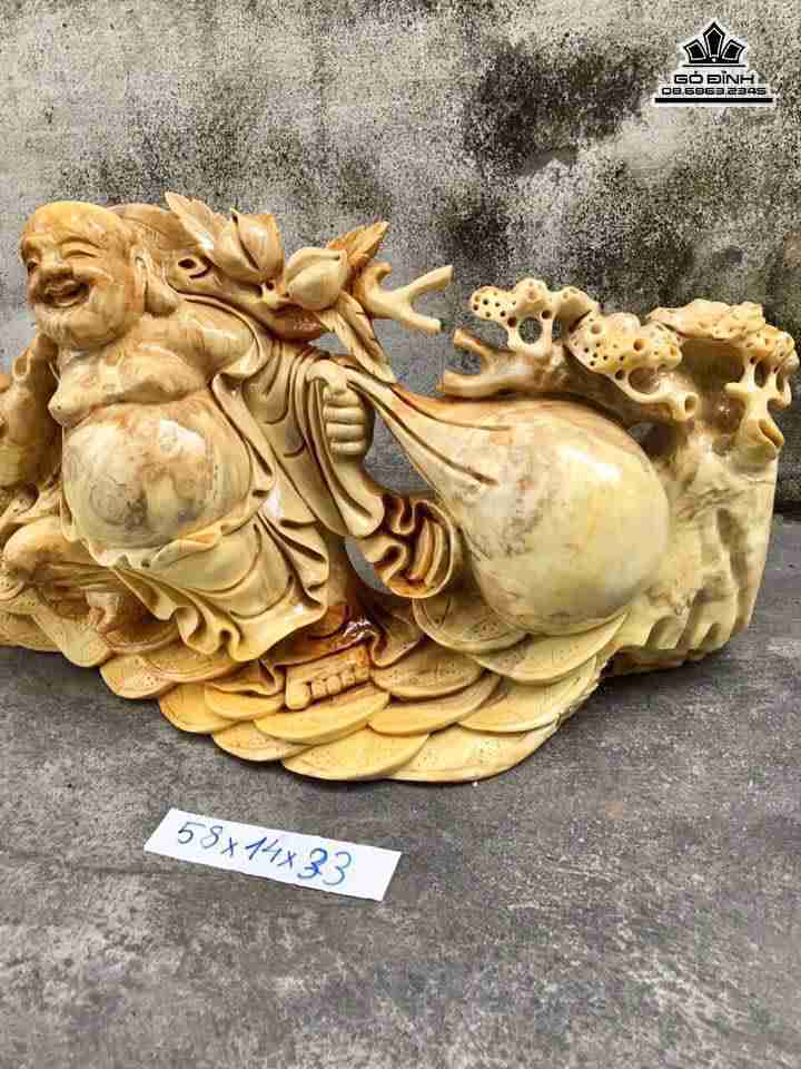 Phật di lặc kéo bao tiền gỗ nu nghiến  2