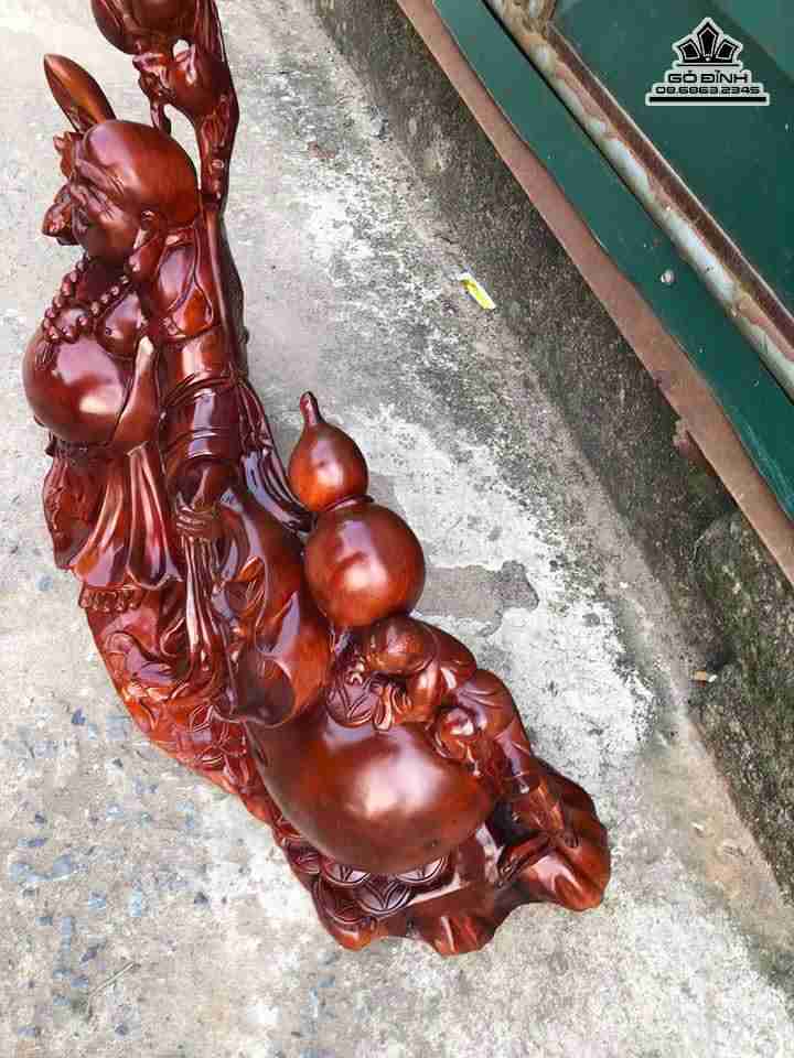 Phật di lặc kéo bao tiền gỗ hương  1