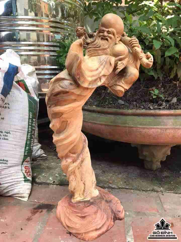 Ông thọ vác gậy như ý gỗ lũa bách xanh  1