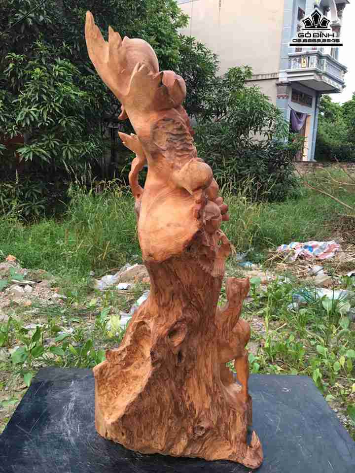 Phat-di-lac-ngoi-goc-dao-go-ngoc-am-cao-70-rong-32-day-30-cm