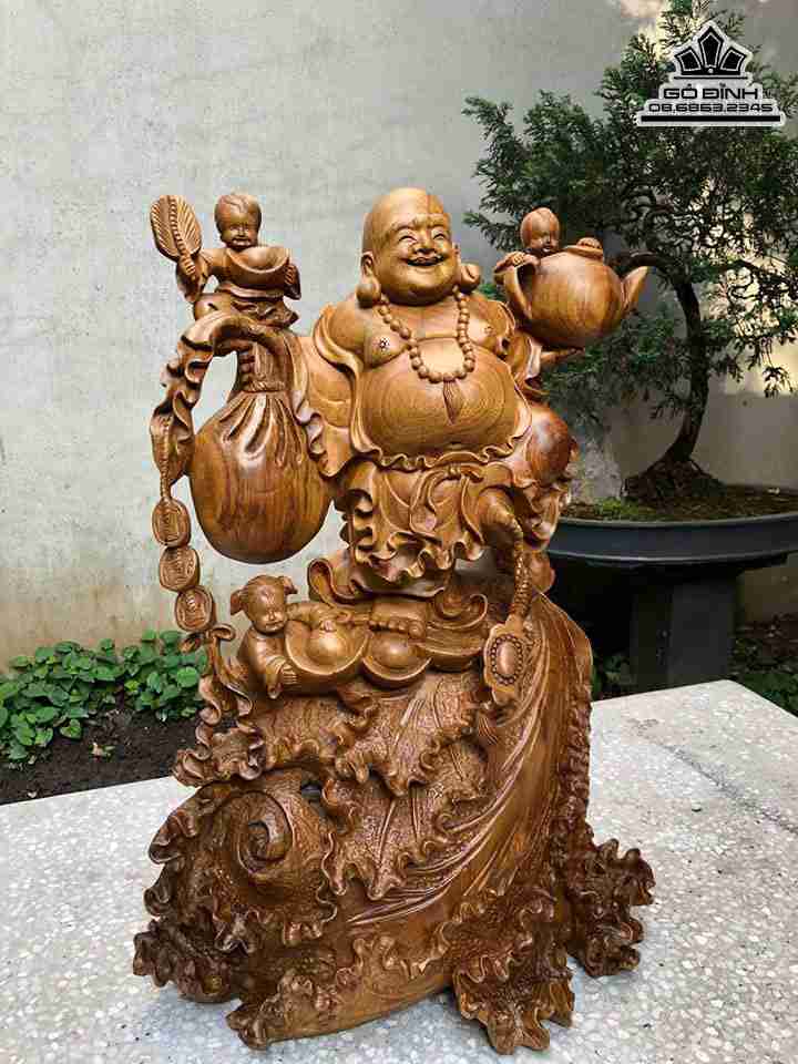 Tuong-Phat-Di-Lac-Dung-Bap-Cai-Go-Bach-Xanh