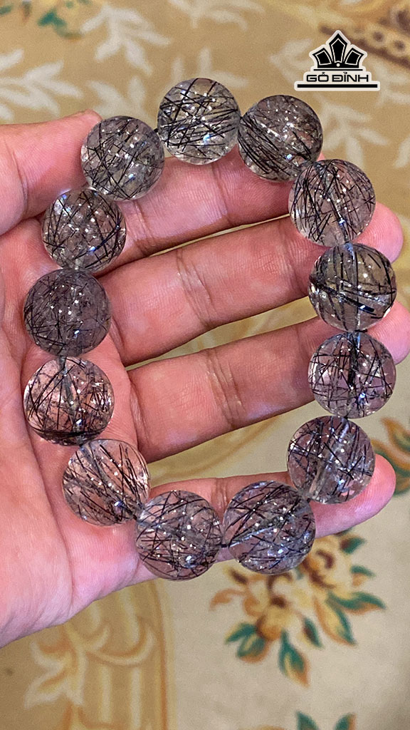 vong-tay-da-thach-anh-toc-den-duong-kinh-18-mm-110g-448183