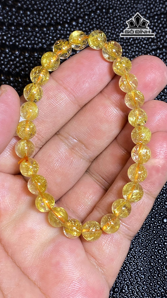 vong-tay-da-thach-anh-toc-vang-duong-kinh-69-mm-128g-448187