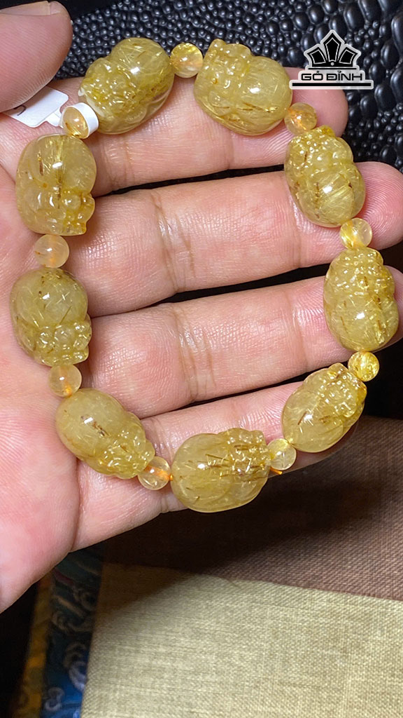 vong-tay-da-thach-anh-toc-vang-duong-kinh-125-mm-435g-453378