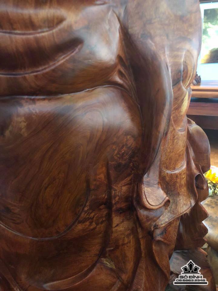 Phật di lặc gỗ nu hương ôm đá  5