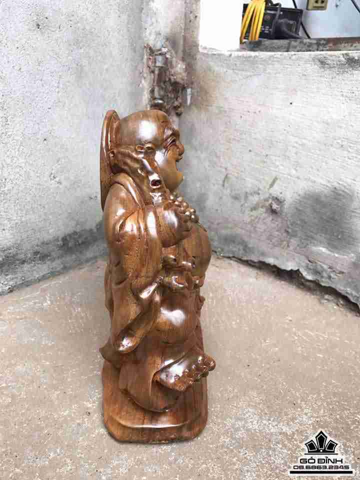 Phật di lặc kéo bao tiền gỗ bách xanh 2