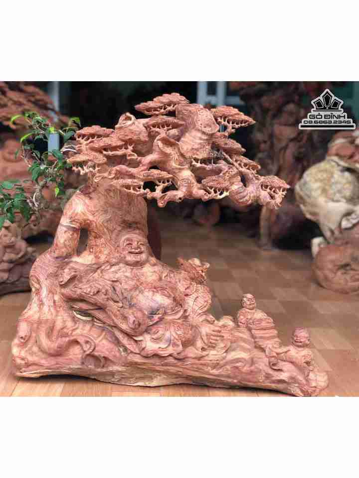 Tượng Phật Di lặc ngồi gốc tùng gỗ hương  cao 60 ngang 70 dày 26 (cm)