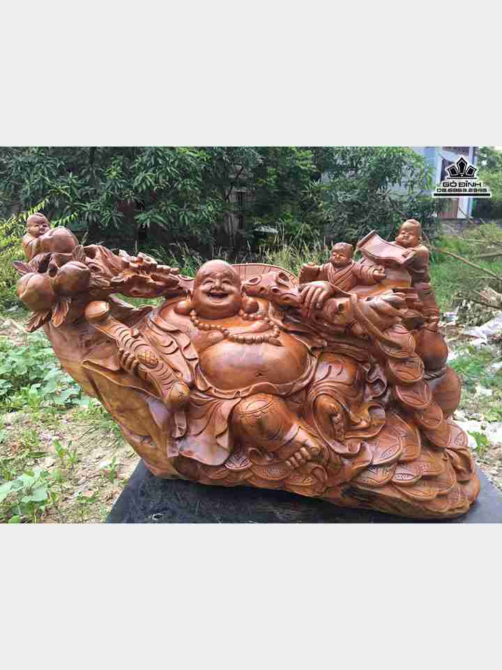 Phật di lặc vác cành đào gỗ xá xị  cao 49 rộng 80 dày 32 (cm)