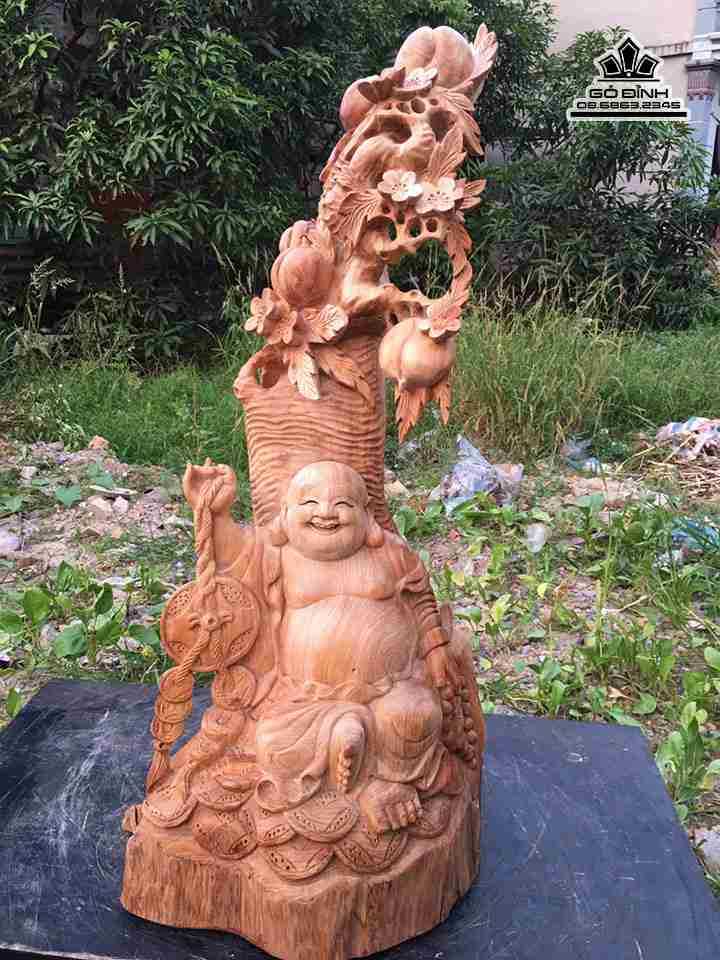 Phật di lặc ngồi gốc đào gỗ ngọc am  cao 70 rộng 32 dày 30 (cm)