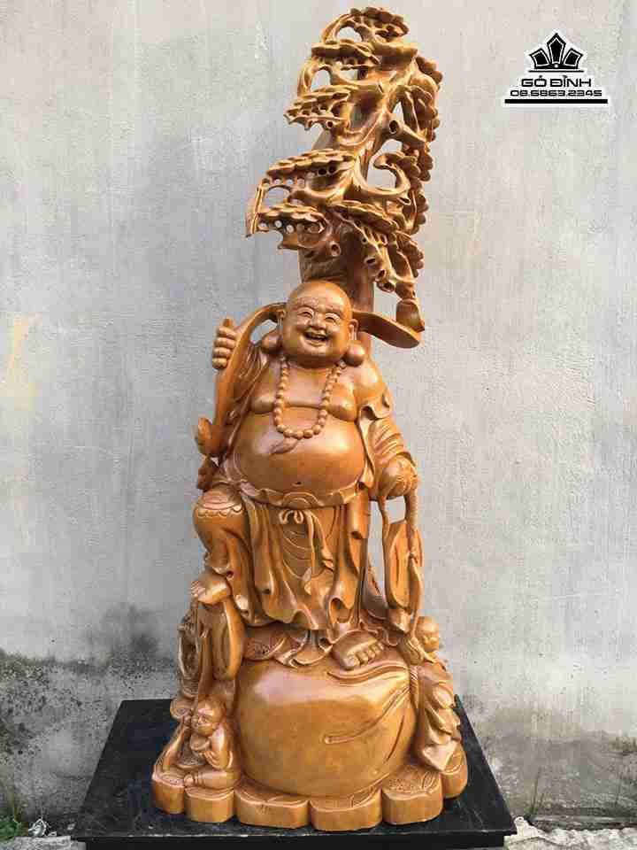 Phật di lặc vác gậy cành tùng gỗ xá xị  cao 125 rộng 50 dày 38 (cm)