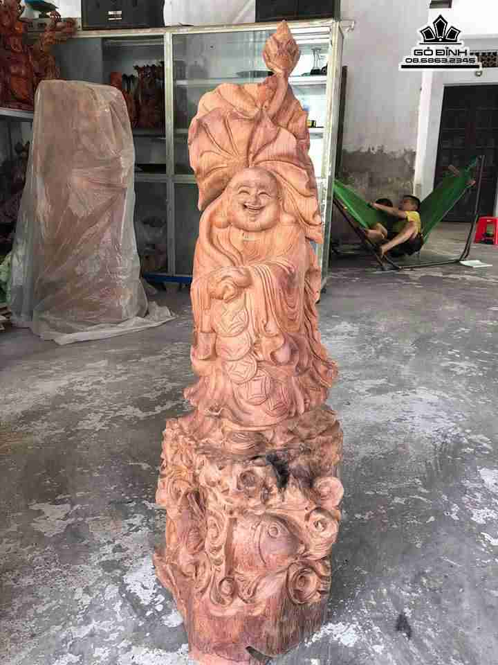 Phật di lặc cưỡi cá gỗ hương  cao 102 rộng 38 dày 32 (cm)