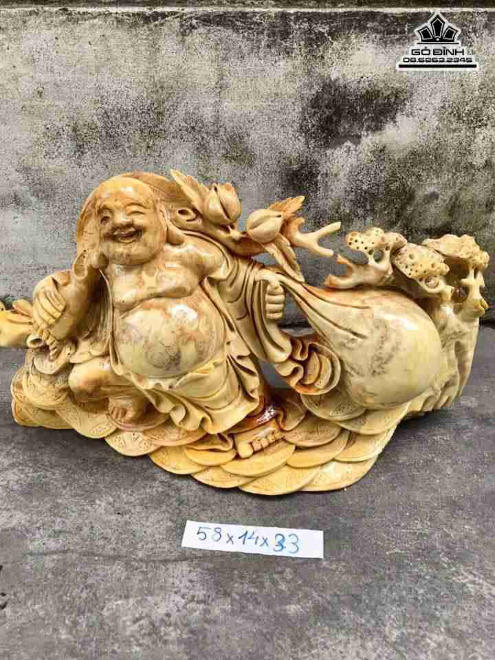 Phật di lặc kéo bao tiền gỗ nu nghiến  dài 58 dày 14 cao 33 (cm)