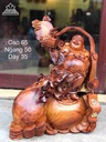 Phật di lặc gỗ hương ôm đá  65x50x35