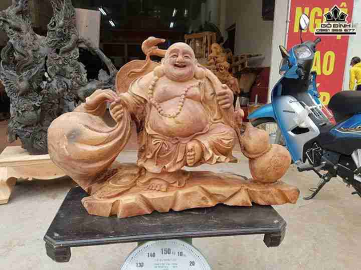 Phật di lặc kéo bao tiền gỗ hương  82x26x52