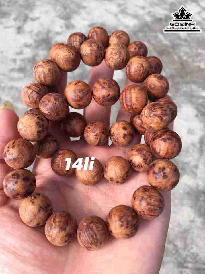 Vòng Tay Hạt Tròn Gỗ Nu Ngọc Am  14 Li