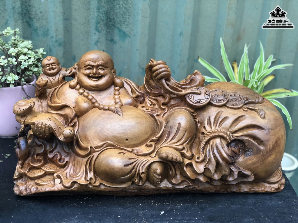 Tượng Phật Di Lặc Chấn Bao Tiền Gỗ Bách Xanh Cao 24 Ngang 50 Sâu 22 (cm)