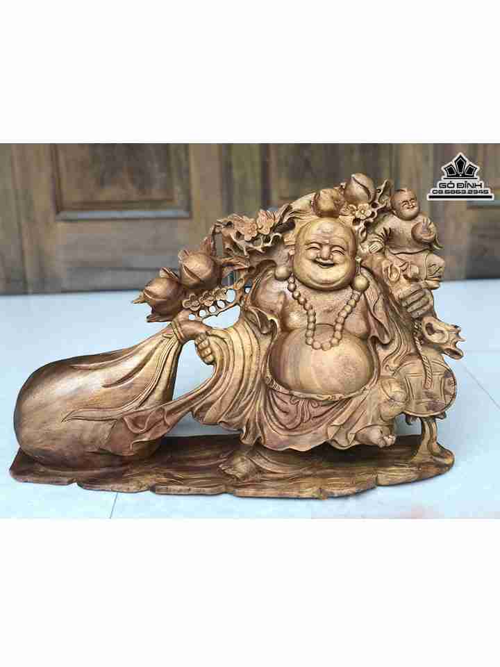 Tượng Phật Di Lặc Kéo Bao Tiền Gỗ Xá Xị ( Gù Hương )  Cao 39 Ngang 63 Sâu 19 (cm)