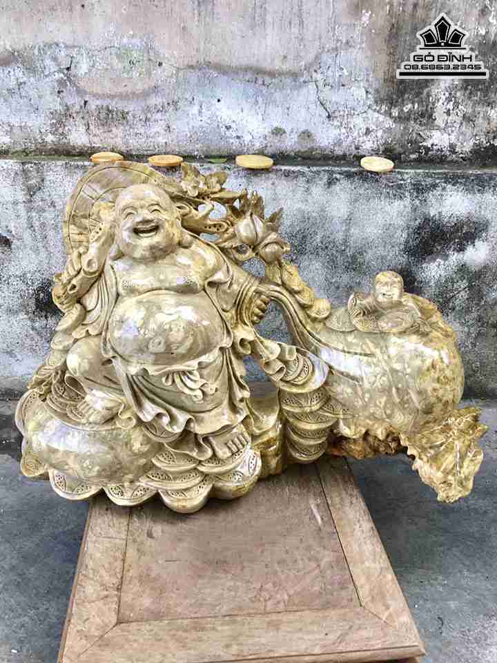 Tượng Phật Di Lặc Kéo Bao Tiền gỗ nu nghiến  rộng 59 cao 38 dày 17 (cm)