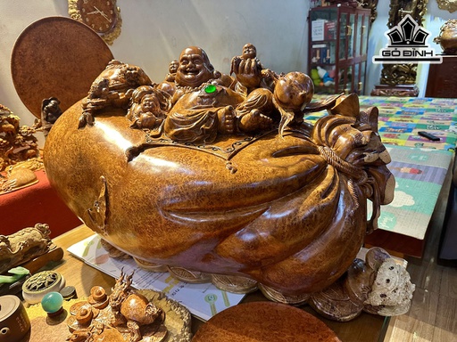 Tượng Phật Di Lặc Ngồi Bao Tiền Gỗ Nu Hương Cao 52 Ngang 110 Sâu 45 (cm)